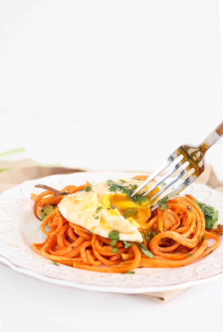 Spiralized Paleo Eggs "Benedict" with Roasted Sweet Potato Noodles, Avocado and Chipotle Hollandaise